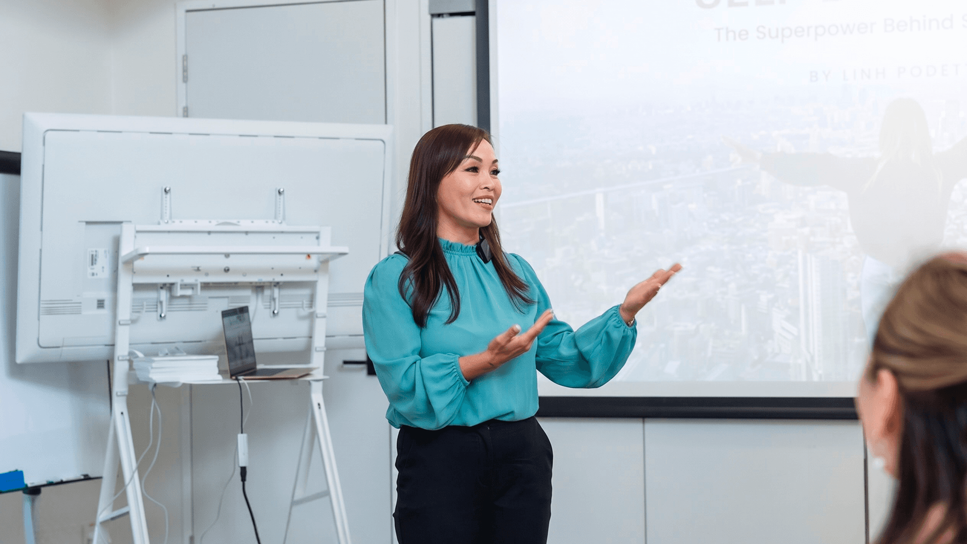 Linh Podetti speaking at an event